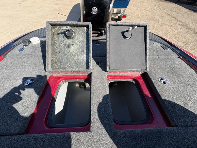 Slide: The Image of 2007 Triton Tr-186 SC boat storage compartments open on deck. - 19