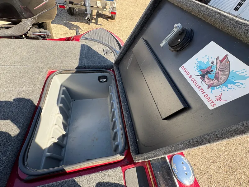 Slide: The Image of Open storage compartment on a 2007 Triton Tr-186 SC boat with a "David & Goliath Baits" sticker. - 20