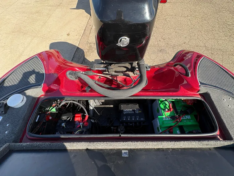 Slide: The Image of 2007 Triton Tr-186 SC boat engine compartment with batteries and wiring. - 22