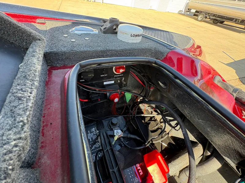 Slide: The Image of 2007 Triton Tr-186 SC boat battery compartment with wiring and components. - 24