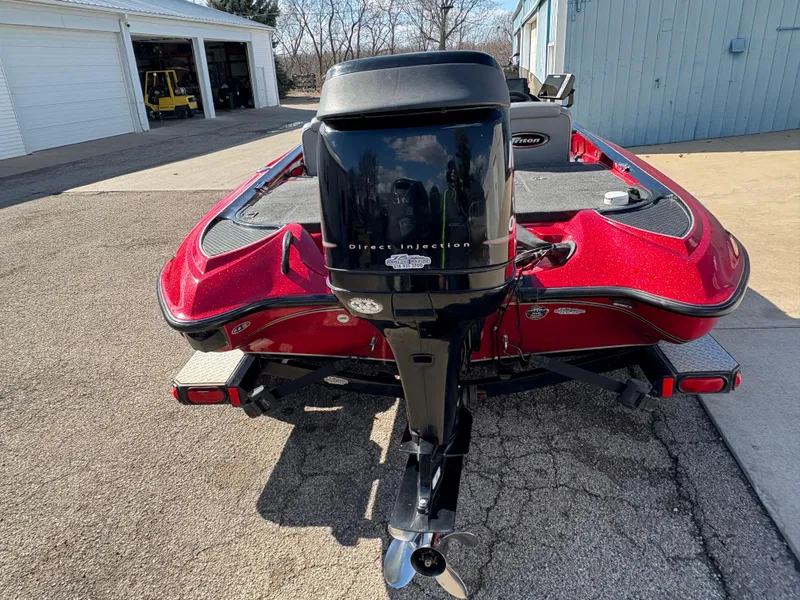 Slide: The Image of 2007 Triton Tr-186 SC boat with direct injection engine, parked outdoors. - 6