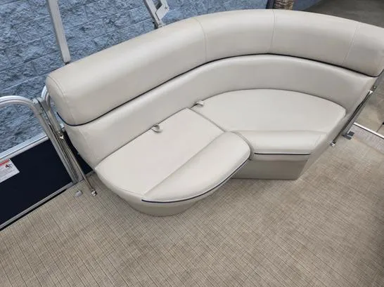 Slide: The Image of 2018 South Bay 222RS boat interior with beige seating and carpeted floor. - 10