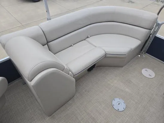 Slide: The Image of 2018 South Bay 222RS pontoon boat with beige seating and carpeted deck. - 3