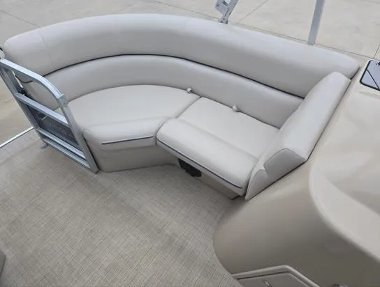 Slide: The Image of 2018 South Bay 222RS pontoon boat with beige seating and spacious deck area. - 4