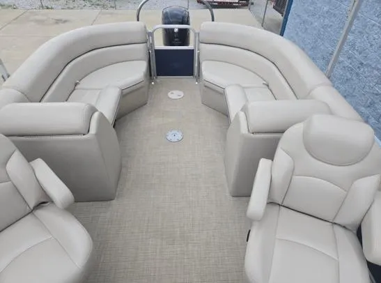 Slide: The Image of 2018 South Bay 222RS pontoon boat with beige seating and spacious interior layout. - 5