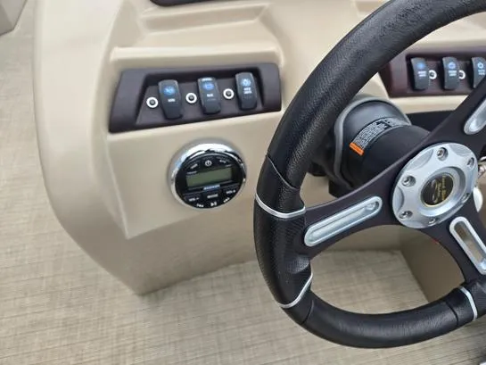 Slide: The Image of Steering wheel and control panel of 2018 South Bay 222RS boat. - 8