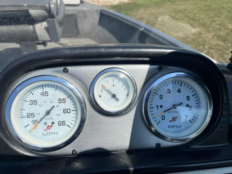 Slide: The Image of Dashboard of a 2017 Lund 1750 Rebel XS SS boat showing speedometer and RPM gauges. - 12