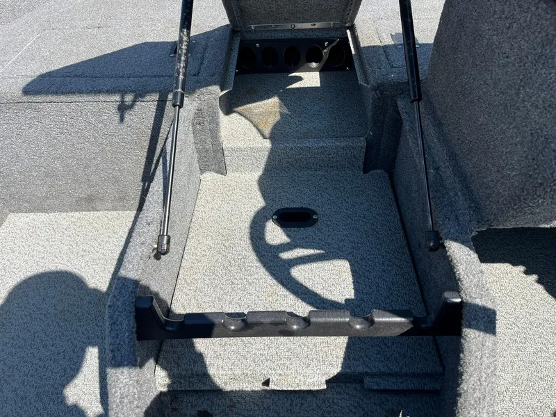 Slide: The Image of 2017 Lund 1750 Rebel XS SS boat interior with open storage compartment. - 16