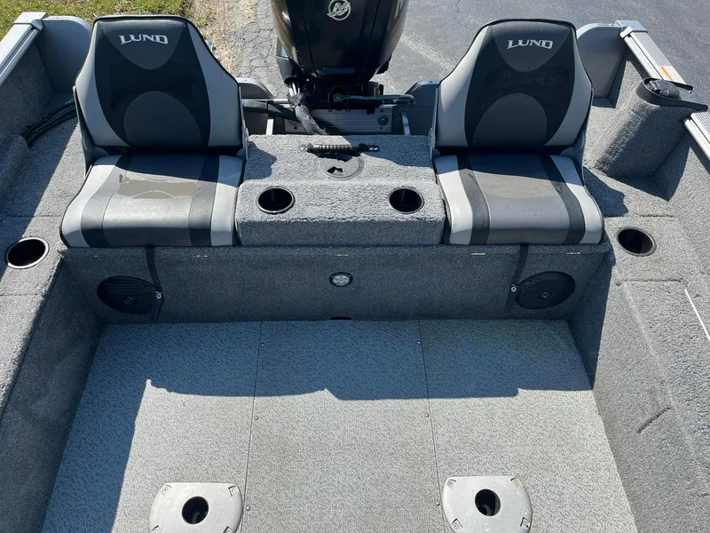 Slide: The Image of 2017 Lund 1750 Rebel XS SS boat interior with seating and storage compartments. - 18