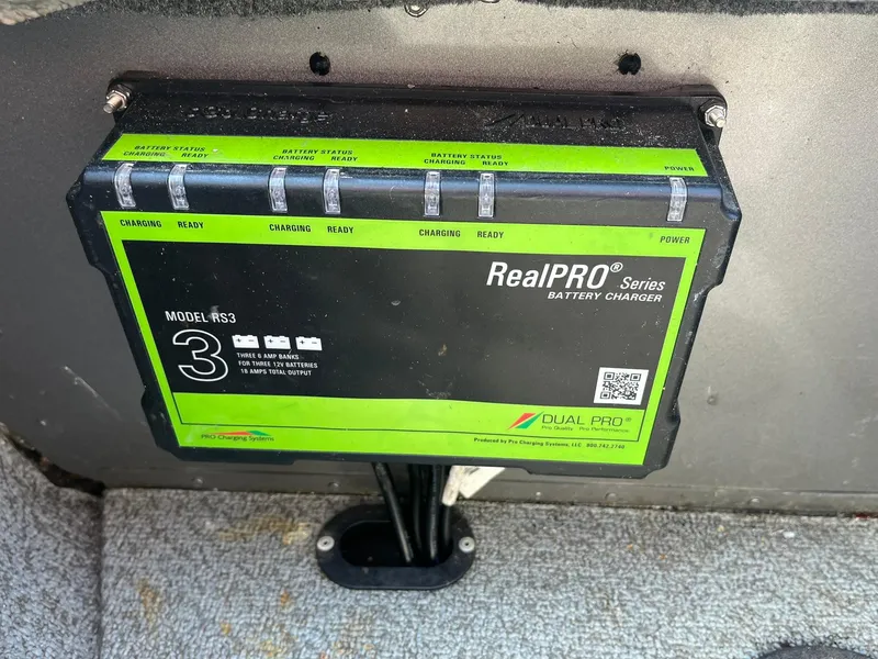 Slide: The Image of RealPRO Series battery charger installed in a 2017 Lund 1750 Rebel XS SS boat. - 26