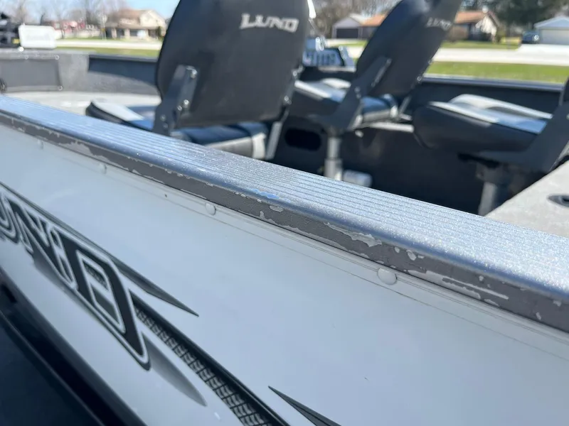 Slide: The Image of 2017 Lund 1750 Rebel XS SS boat interior with seating and visible wear. - 28