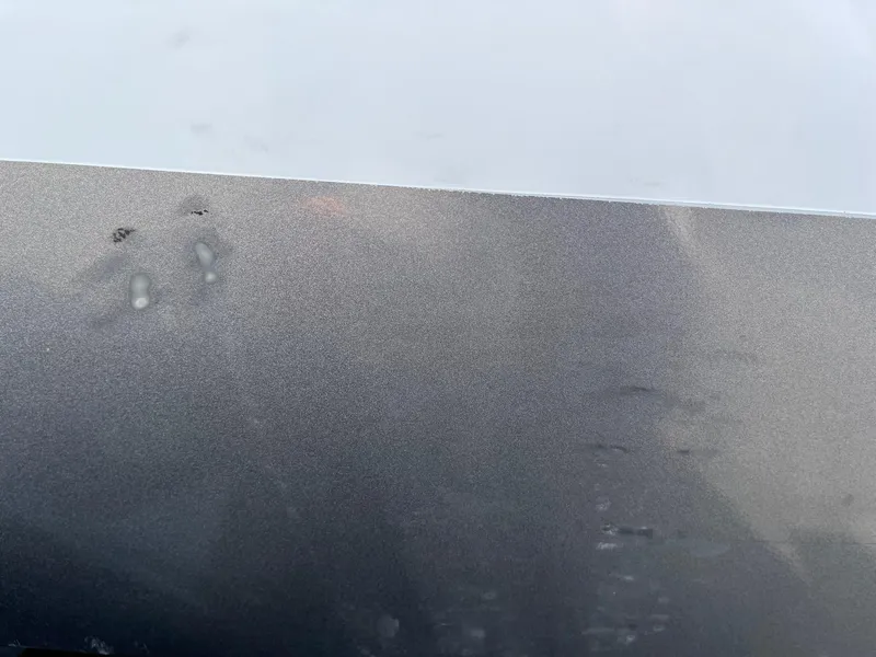 Slide: The Image of Close-up of a 2017 Lund 1750 Rebel XS SS boat surface with minor blemishes. - 29