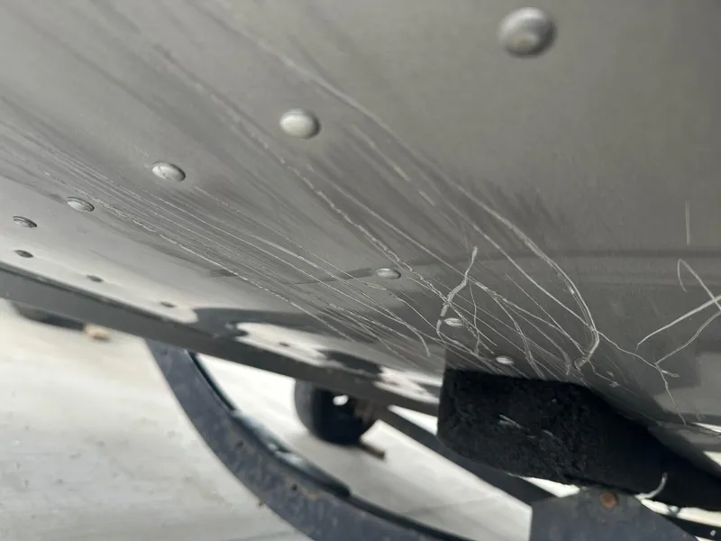 Slide: The Image of Scratches on the hull of a 2017 Lund 1750 Rebel XS SS boat. - 33