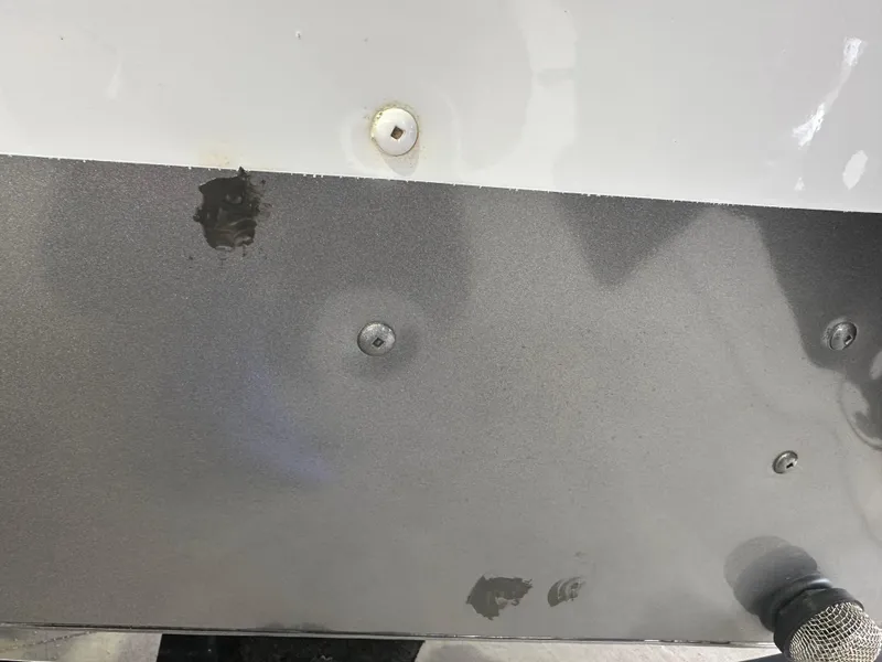 Slide: The Image of 2017 Lund 1750 Rebel XS SS boat with visible hull damage and scratches. - 34