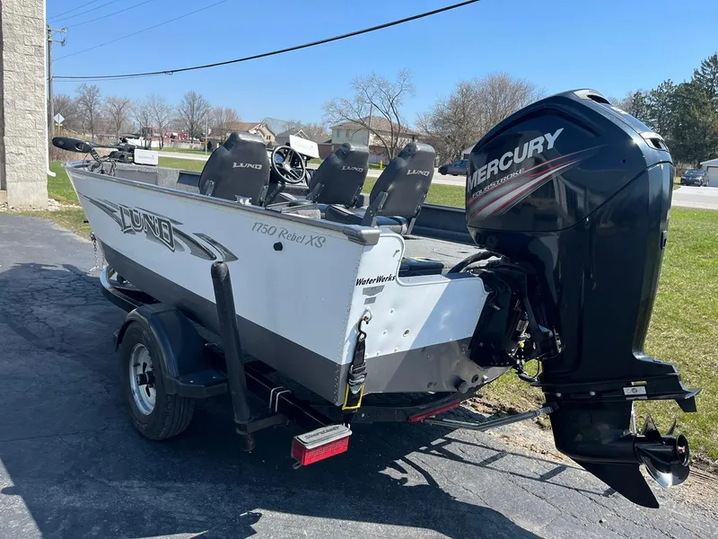 Slide: The Image of 2017 Lund 1750 Rebel XS SS boat with Mercury outboard motor on a trailer. - 4