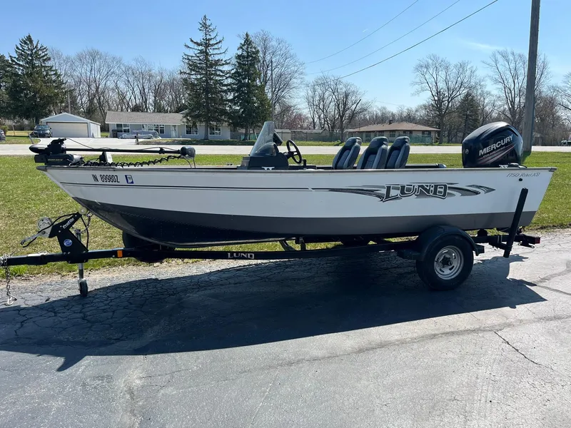 Slide: The Image of 2017 Lund 1750 Rebel XS SS fishing boat on trailer, parked outdoors. - 5