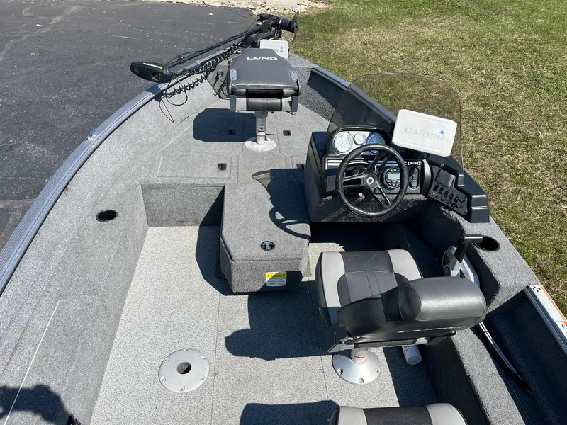 Slide: The Image of 2017 Lund 1750 Rebel XS SS boat interior with steering console and seating. - 6