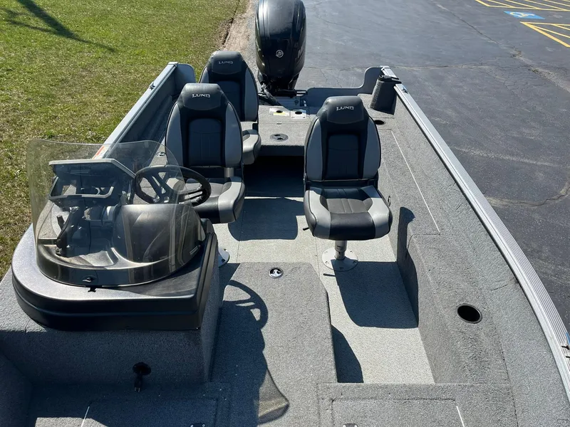 Slide: The Image of 2017 Lund 1750 Rebel XS SS boat interior with steering console and seating. - 8