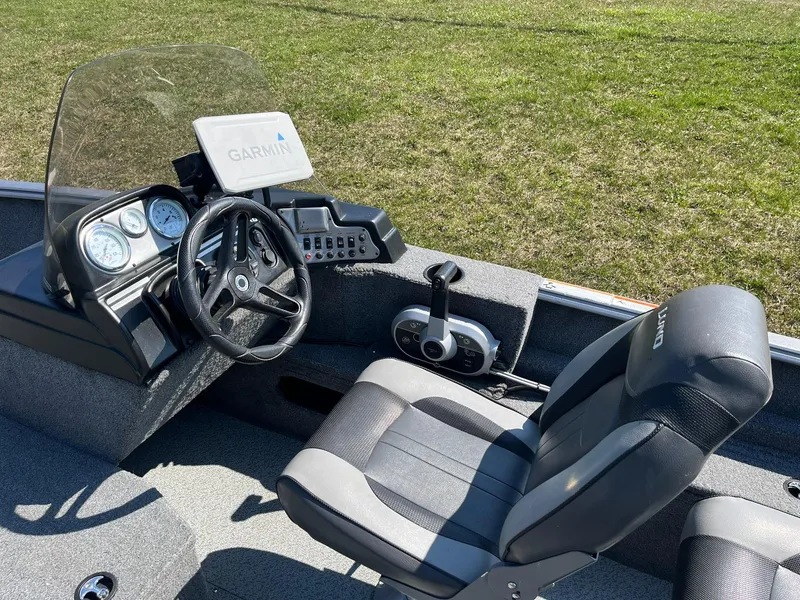 Slide: The Image of 2017 Lund 1750 Rebel XS SS boat interior with Garmin navigation system and steering console. - 9