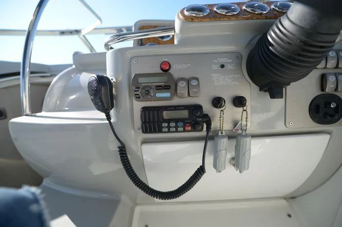 Slide: The Image of Control panel of a 2007 Formula 34 PC boat with radio and gauges. - 13
