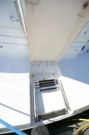 Slide: The Image of 2007 Formula 34 PC boat with a retractable swim ladder on deck. - 14