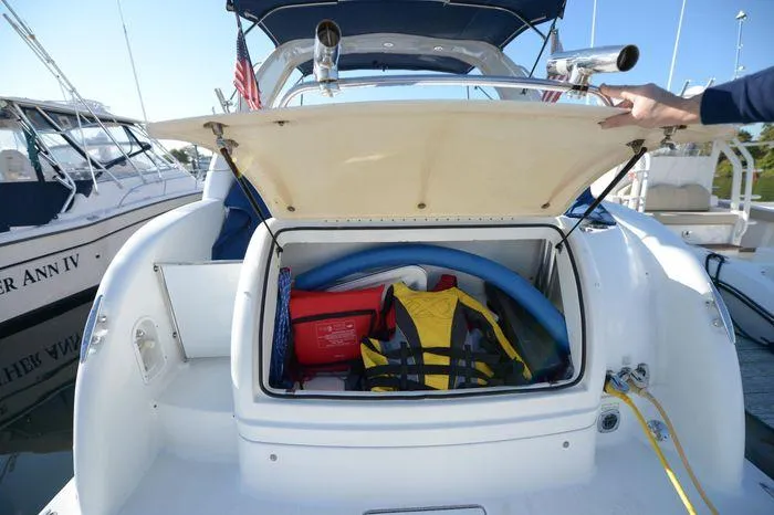 Slide: The Image of 2007 Formula 34 PC boat storage with life jacket and pool noodles. - 15