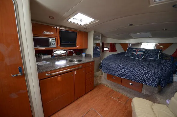 Slide: The Image of Interior of 2007 Formula 34 PC yacht with kitchen and cozy sleeping area. - 25