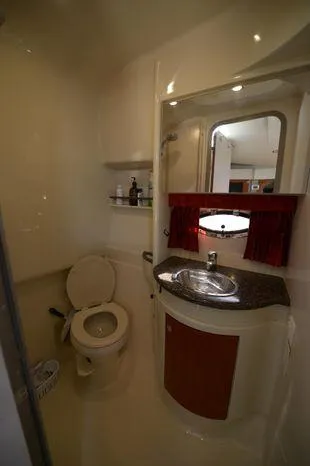 Slide: The Image of 2007 Formula 34 PC yacht bathroom with sink, mirror, and toilet. - 34