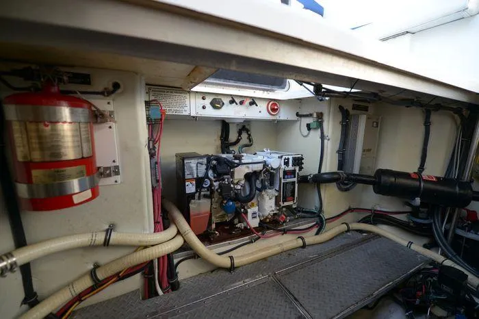Slide: The Image of Engine compartment of a 2007 Formula 34 PC boat, featuring wiring and fire extinguisher. - 39