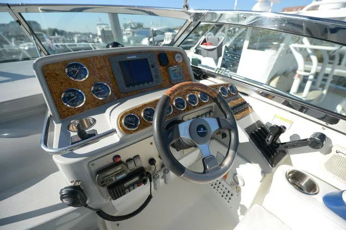 Slide: The Image of 2007 Formula 34 PC boat dashboard with steering wheel and control panel. - 8
