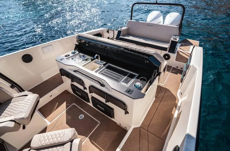 Slide: The Image of 2025 Navan S30 boat interior with luxurious seating and modern amenities on the water. - 9