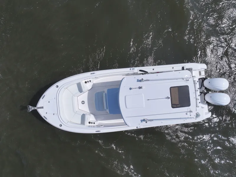 Slide: The Image of Aerial view of 2022 Edgewater 280CC boat on water. - 3