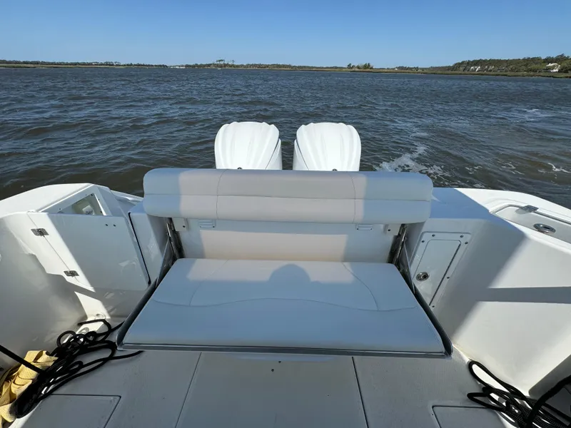 Slide: The Image of 2022 Edgewater 280CC boat with dual engines on open water. - 40