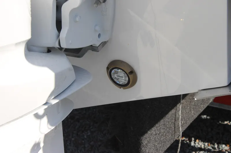 Slide: The Image of Close-up of 2022 Edgewater 280CC boat's hull detail and hardware. - 45