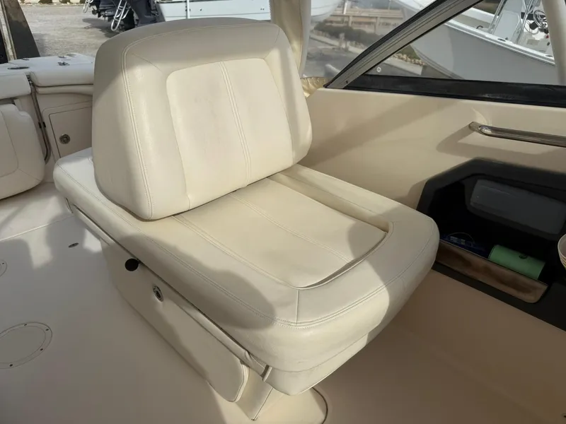 Slide: The Image of 2015 Grady-White Freedom 255 boat interior with beige seating. - 15