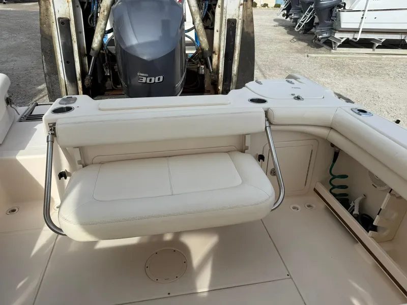Slide: The Image of 2015 Grady-White Freedom 255 boat interior with foldable seating and Yamaha 300 engine. - 16