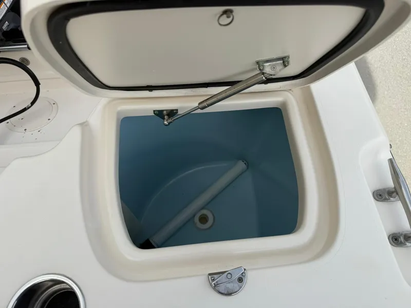 Slide: The Image of Open storage compartment on 2015 Grady-White Freedom 255 boat. - 18