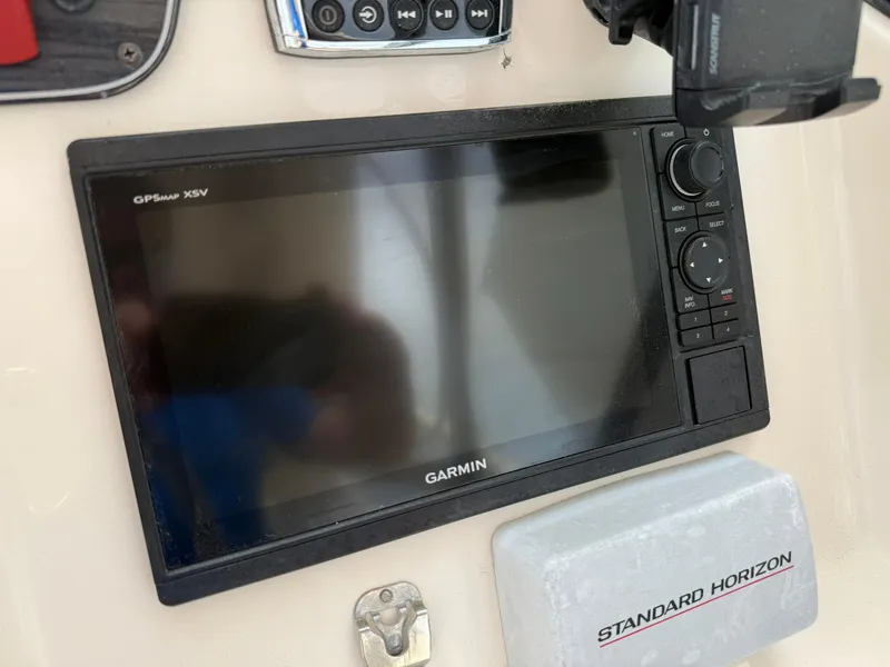 Slide: The Image of Garmin GPS display on 2015 Grady-White Freedom 255 boat dashboard. - 25