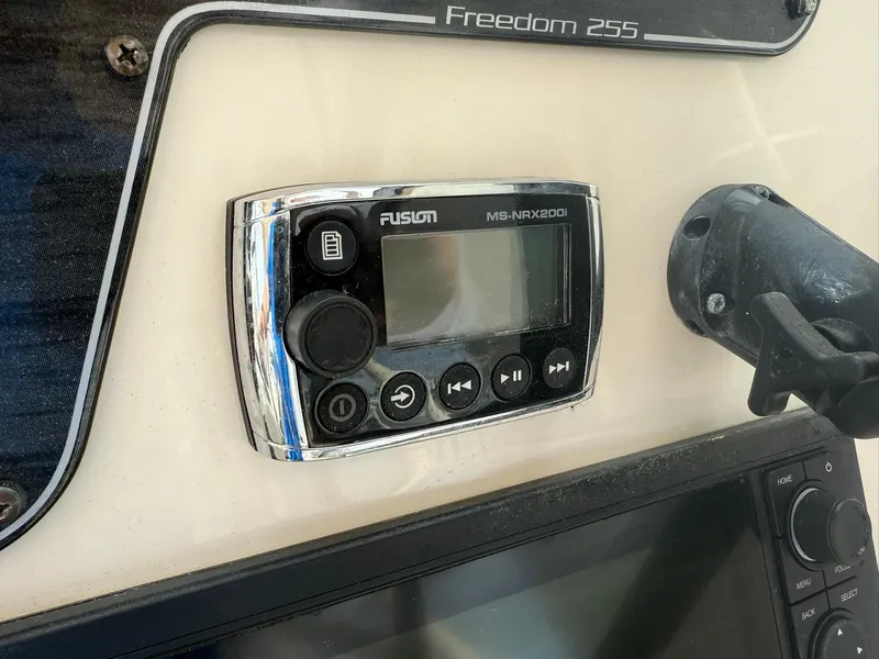 Slide: The Image of Control panel on 2015 Grady-White Freedom 255 boat with Fusion stereo system. - 26