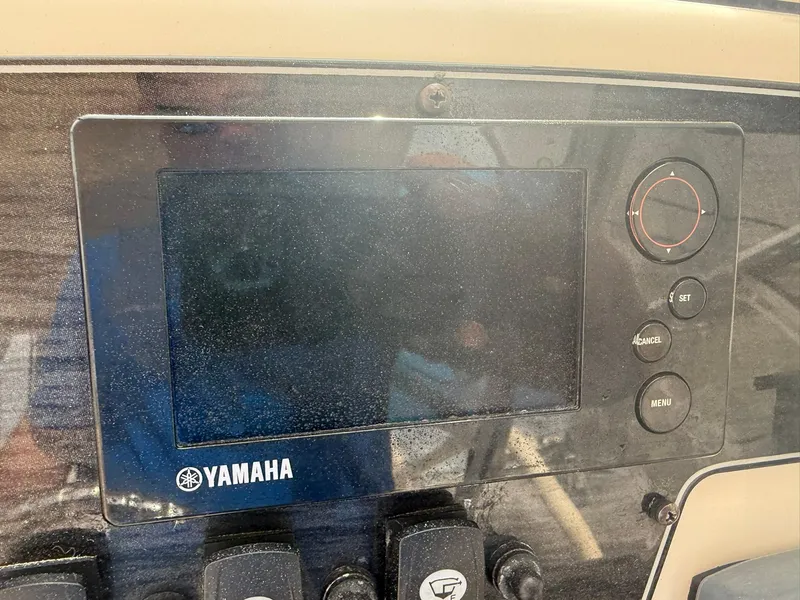 Slide: The Image of Yamaha control panel on 2015 Grady-White Freedom 255 boat dashboard. - 27