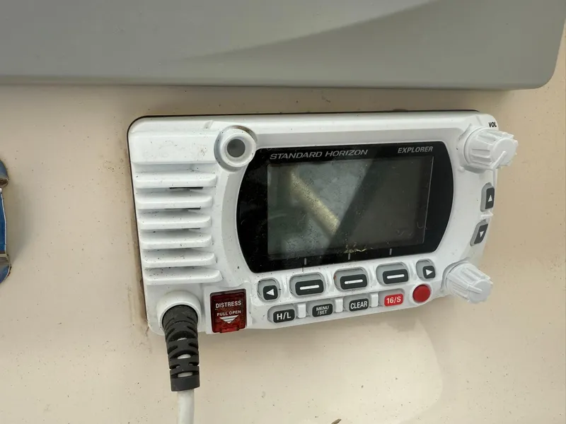 Slide: The Image of VHF marine radio on 2015 Grady-White Freedom 255 boat dashboard. - 28