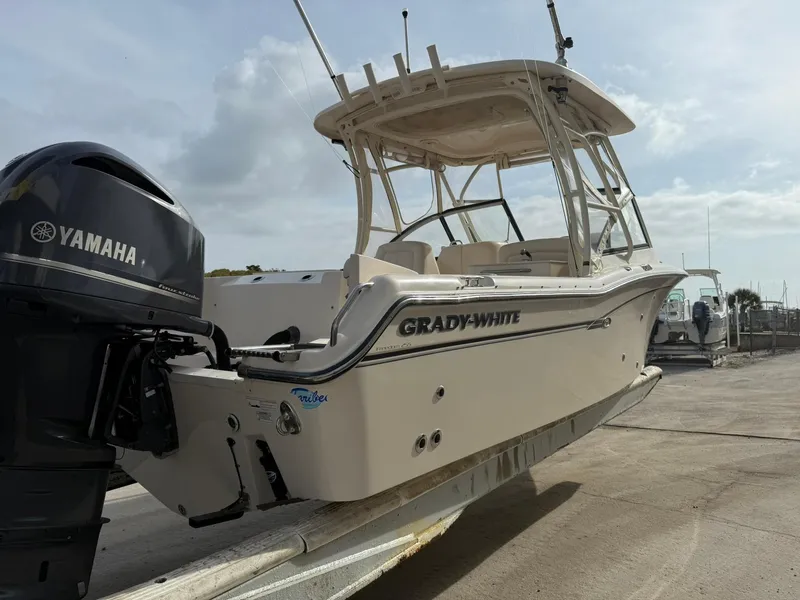 Slide: The Image of 2015 Grady-White Freedom 255 boat with Yamaha engine on a trailer. - 4