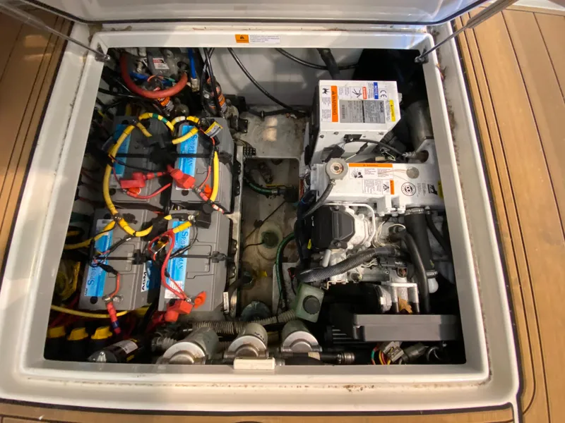 Slide: The Image of Engine compartment of 2016 Chris-Craft Catalina 34, showcasing batteries and wiring. - 20