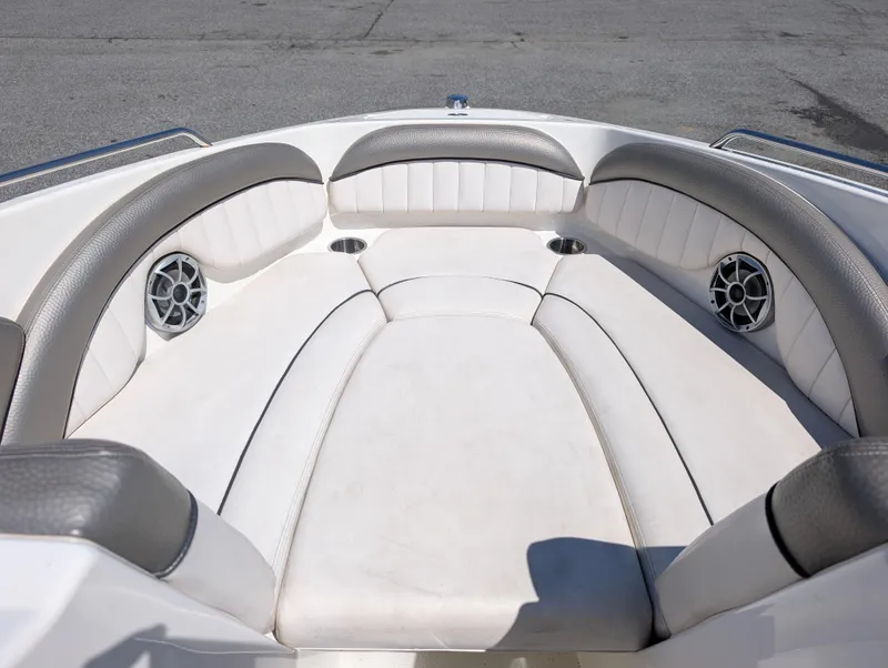 Slide: The Image of 2008 Yamaha Boats SX230 HO interior with white cushioned seating and built-in speakers. - 10