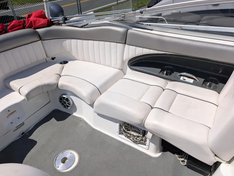Slide: The Image of 2008 Yamaha Boats SX230 HO interior with white seating and cup holders. - 8