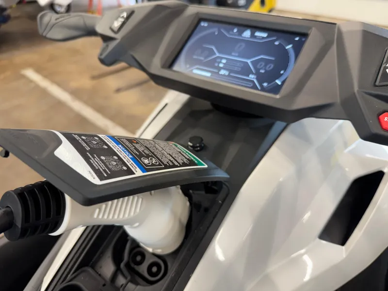 Slide: The Image of Charging port and dashboard of 2024 Taiga Orca electric vehicle. - 12