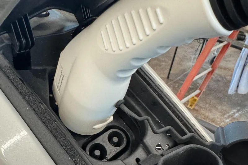 Slide: The Image of Charging port of 2024 Taiga Orca electric vehicle with connector plugged in. - 17