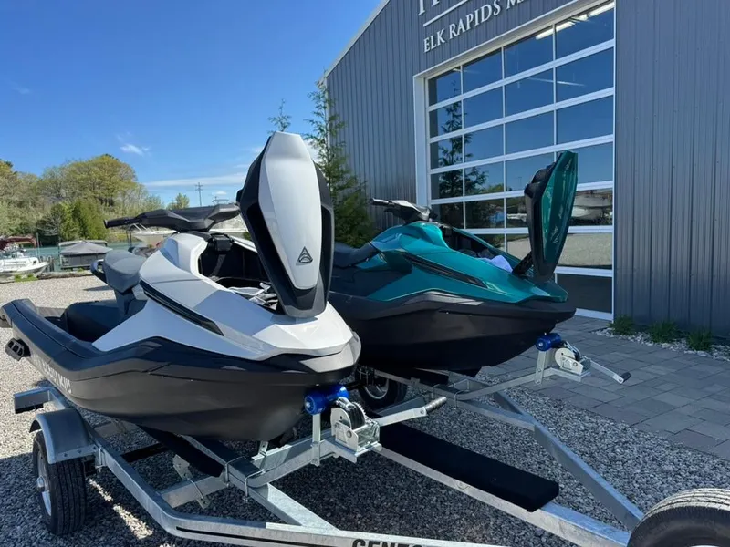 Slide: The Image of 2024 Taiga Orca jet skis on trailer outside Elk Rapids Marine building. - 5