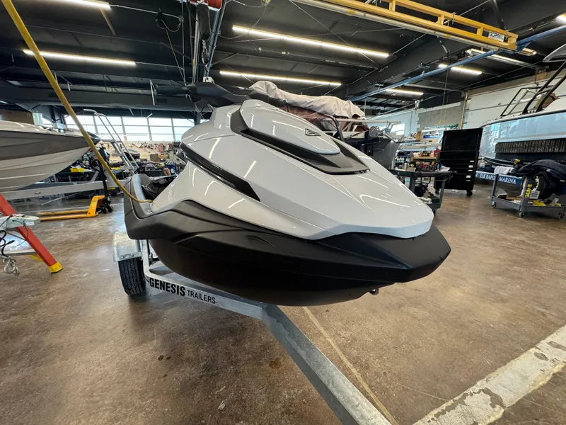 Slide: The Image of 2024 Taiga Orca jet ski on trailer in a workshop setting. - 9