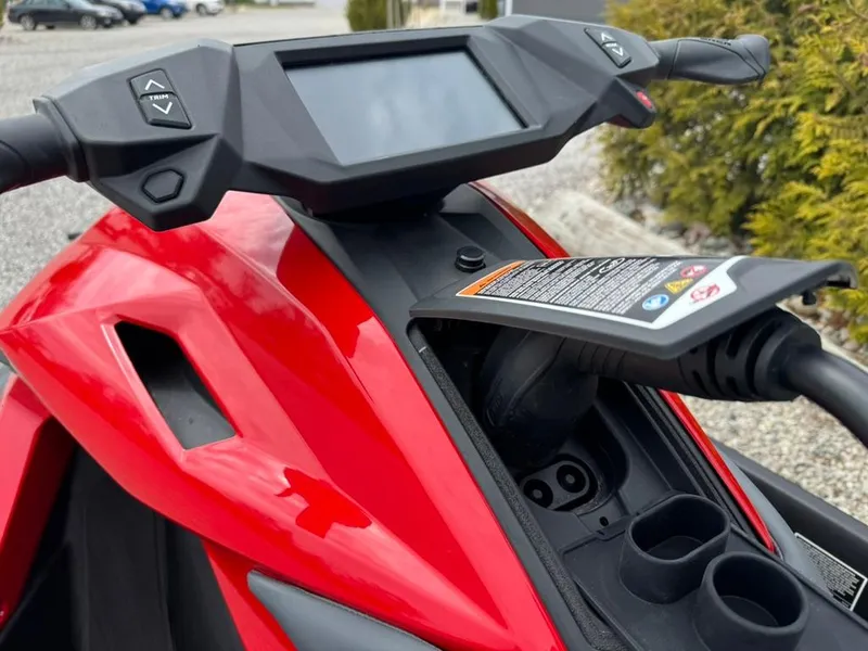 Slide: The Image of 2024 Taiga Orca dashboard and charging port, featuring a sleek red design. - 2